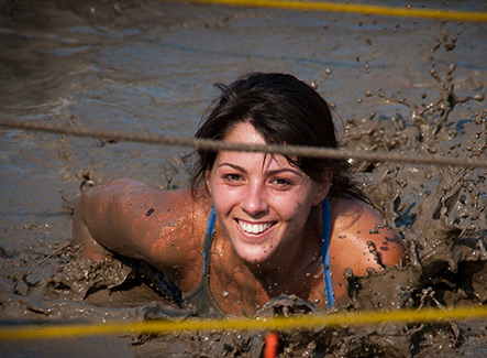 Girl crawling in mud
